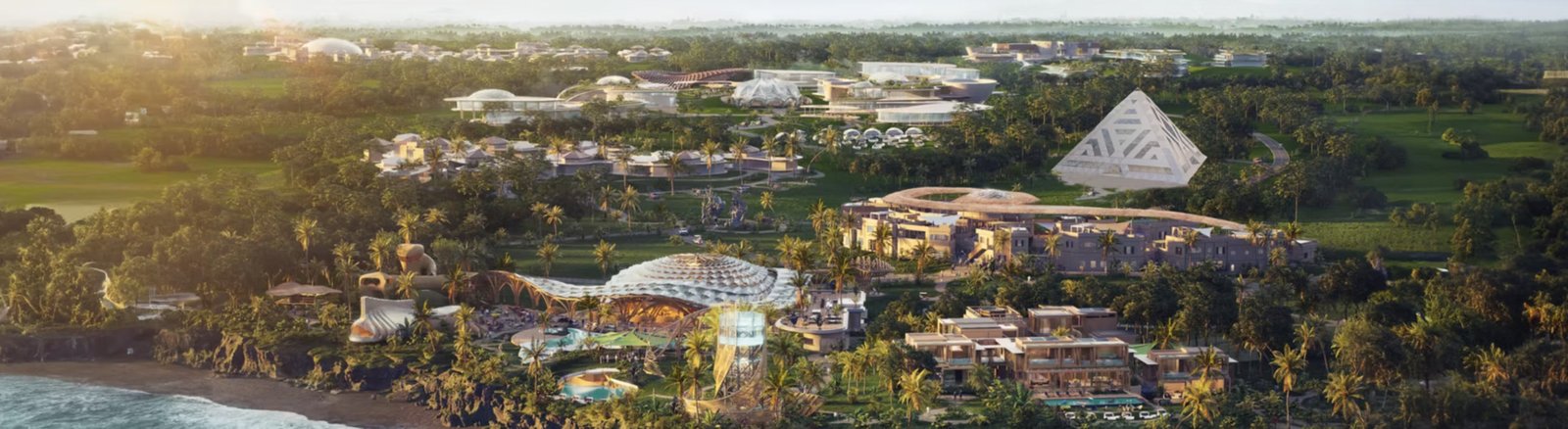 Nuanu Creative City — aerial view of the full creative city campus in Tabanan, Bali, showing the pyramid, beach club, art installations and lush grounds